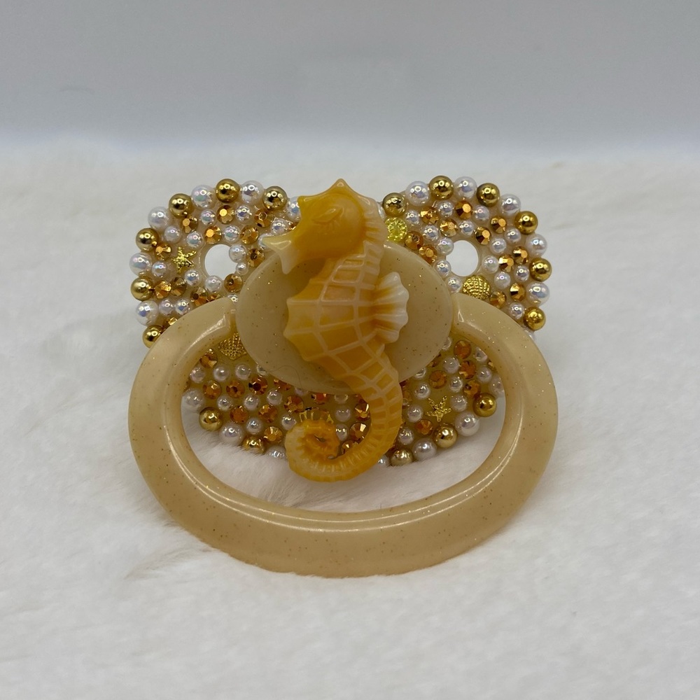 Gold sea horse adult pacifier